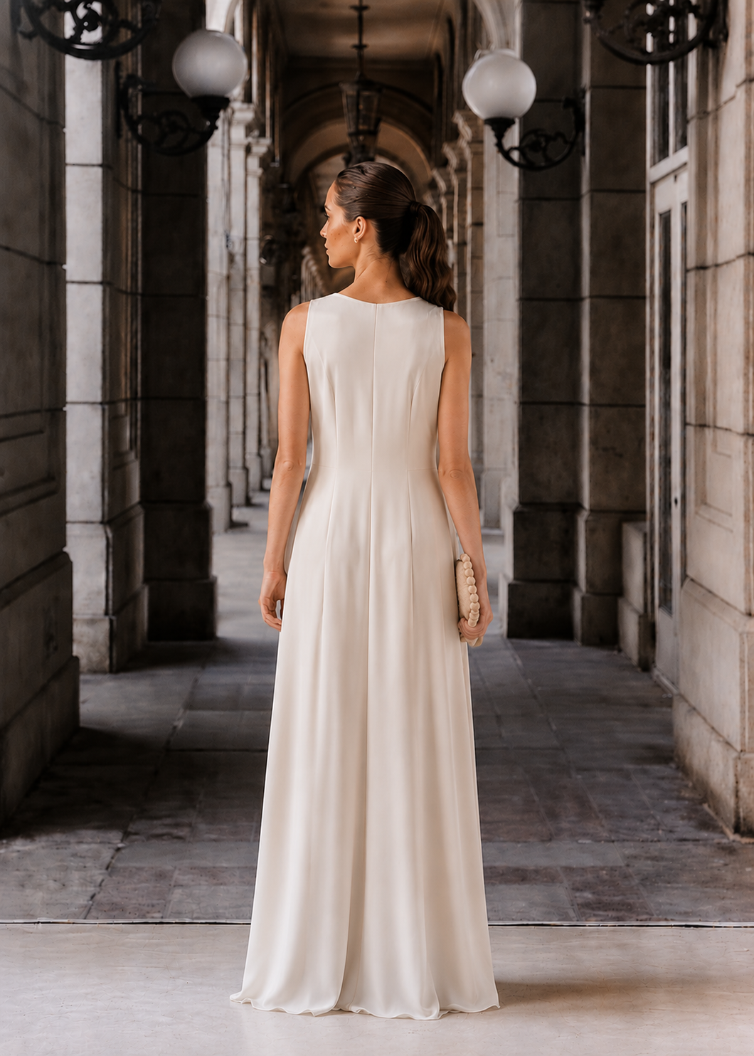 Ivory evening sleeveless draped dress with a golden trim