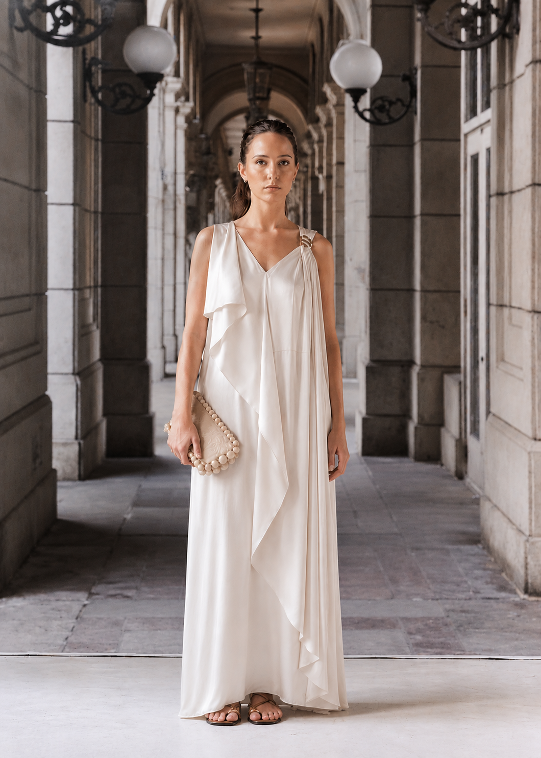 Ivory evening sleeveless draped dress with a golden trim