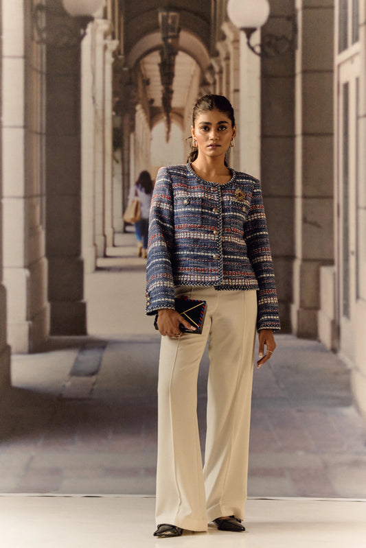 Blue red and white jacket with broach