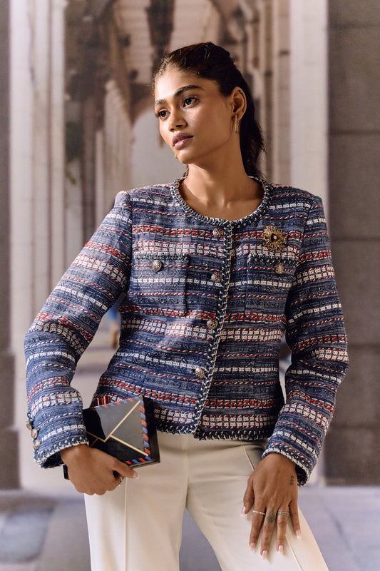 Blue red and white jacket with broach